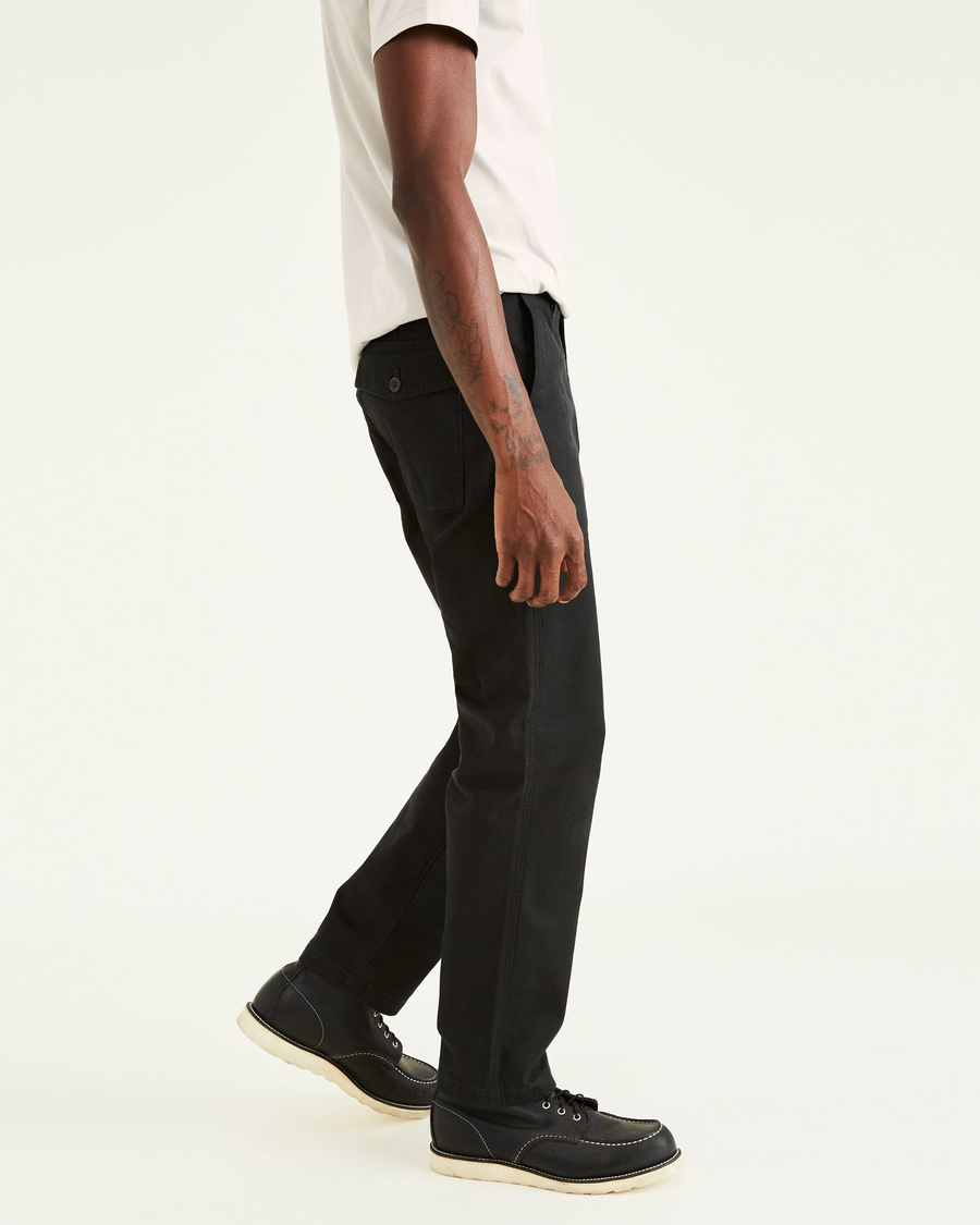 Side view of model wearing Beautiful Black Dockers® x Jon Rose Collection Fatigue Pants, Straight Fit.