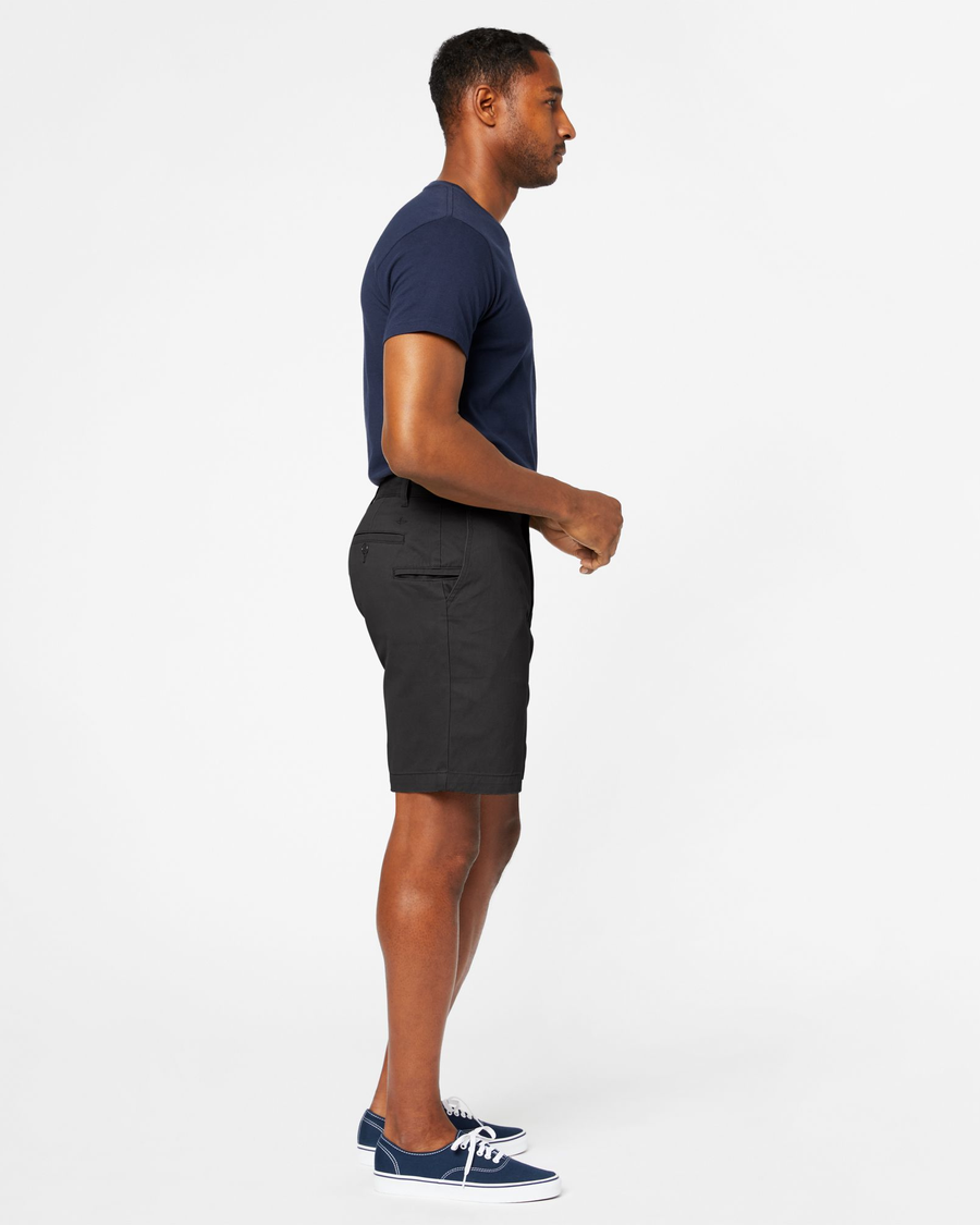 Side view of model wearing Black Perfect 8" Shorts.