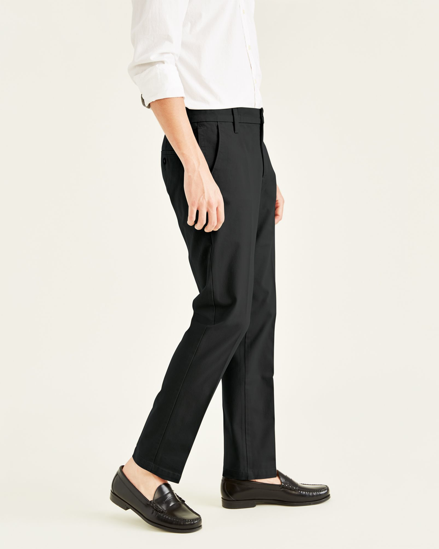 Side view of model wearing Black Workday Khakis, Slim Fit.