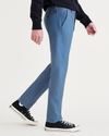 Side view of model wearing Blue Fusion Comfort Knit Chinos, Slim Fit.
