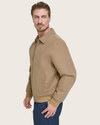 Side view of model wearing Brown Microtwill Relaxed Bomber Jacket.