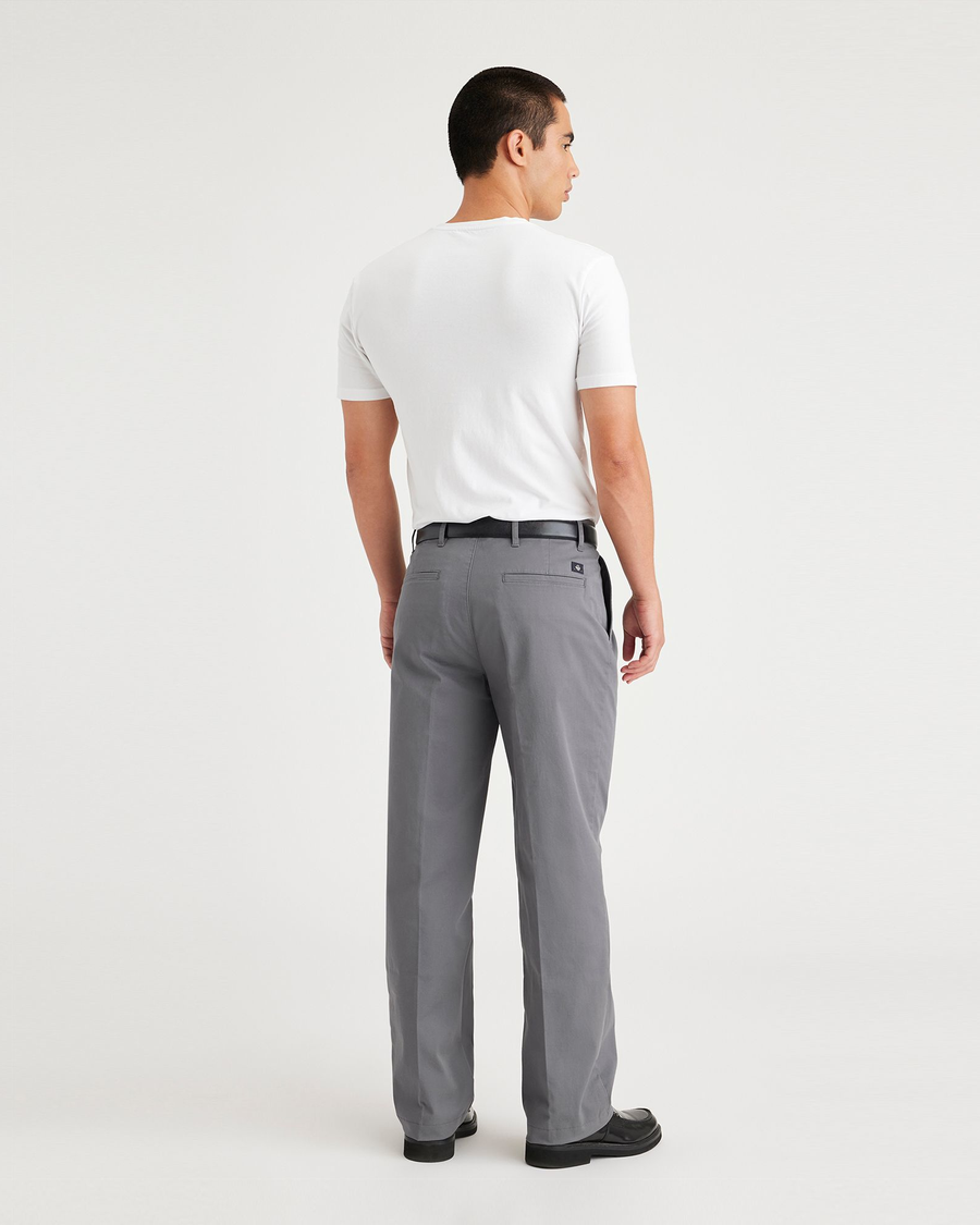 Back view of model wearing Car Park Grey Essential Chinos, Pleated, Classic Fit.