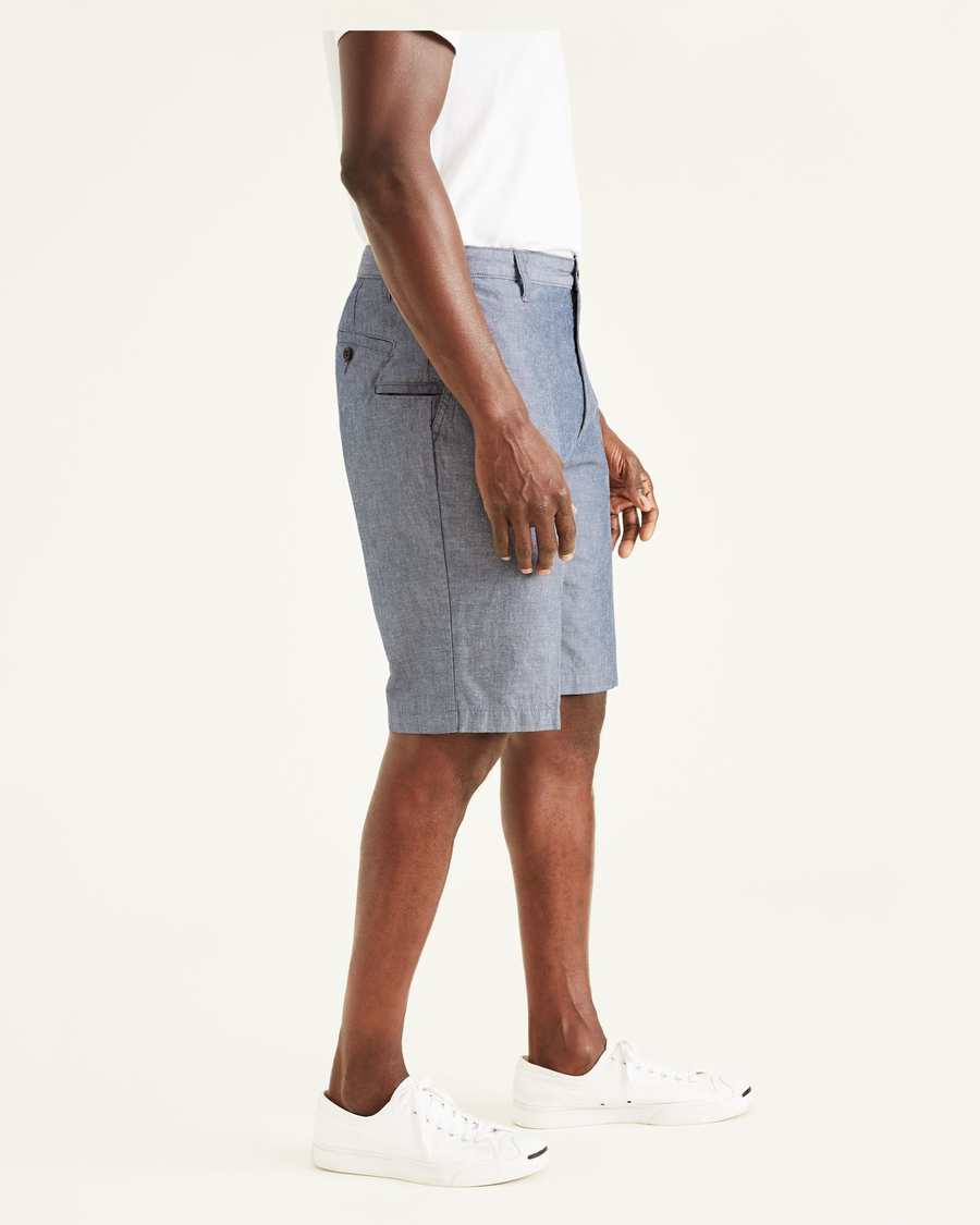 Side view of model wearing Clarke Chambray Faded Navy Perfect 10.5" Shorts.