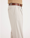 Side view of model wearing Cloud Easy Khakis, Pleated, Classic Fit.