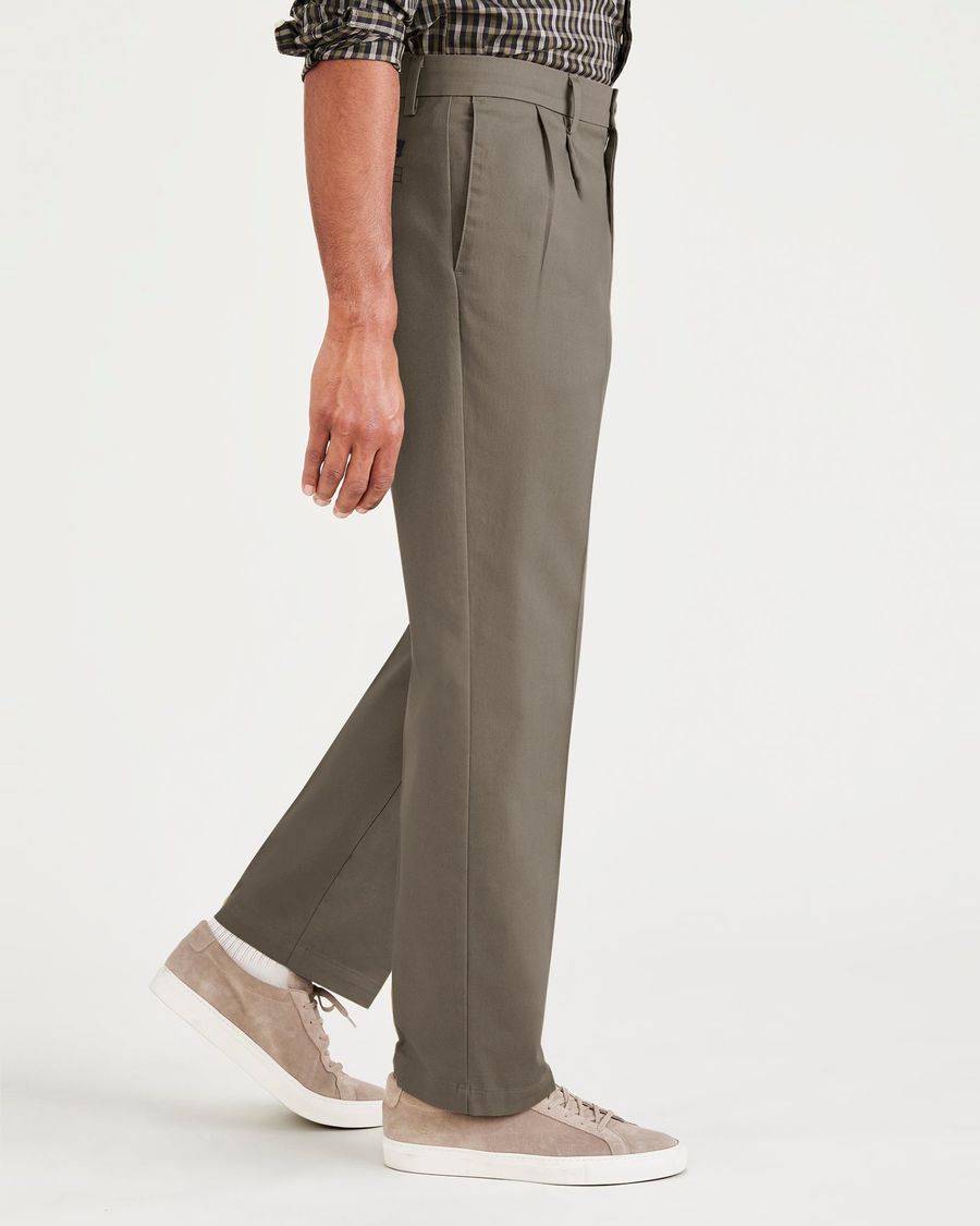 Side view of model wearing Dark Pebble Signature Iron Free Khakis, Pleated, Classic Fit with Stain Defender® (Big and Tall).