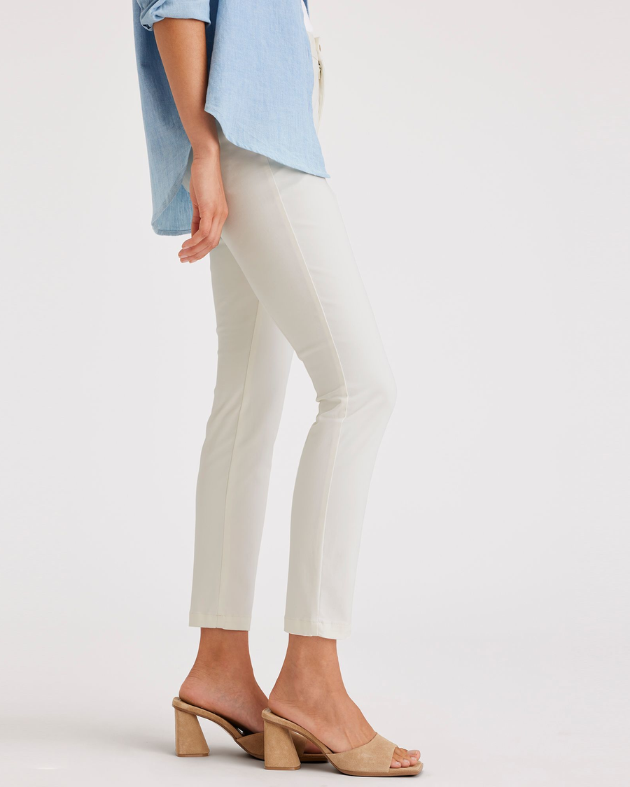 Side view of model wearing Egret Weekend Chinos, Skinny Fit: Premium Edition.