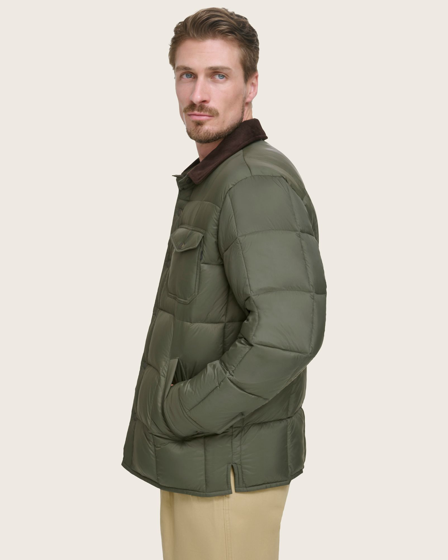 Side view of model wearing Forest Green Midweight Box Quilted Jacket.
