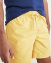 View of model wearing Golden Apricot Playa 7" Shorts.