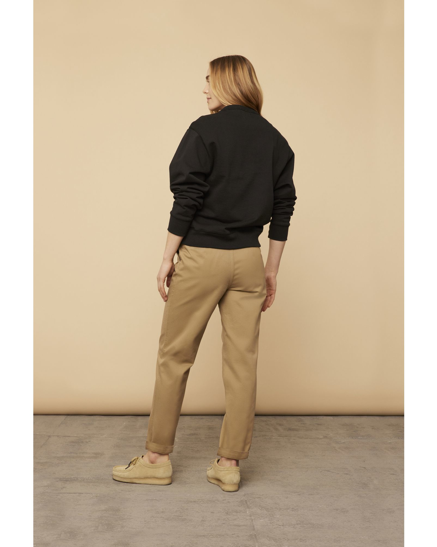 View of model wearing Golden Khaki Dockers® Made in the USA Chinos, Relaxed Tapered Fit.