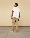 Back view of model wearing Golden Khaki Dockers® Made in the USA Chinos, Relaxed Tapered Fit.