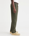 Side view of model wearing Green Crisp Original Chinos, Relaxed Tapered Fit.