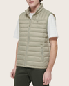 Side view of model wearing Green Packable Puffer Vest.