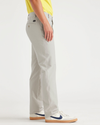 Side view of model wearing Grit Comfort Knit Chinos, Slim Fit.