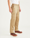 Side view of model wearing Harvest Gold Cargo Pants, Relaxed Fit.