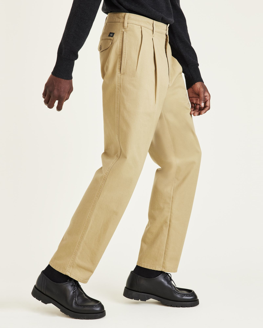 Side view of model wearing Harvest Gold Original Khakis, Relaxed Fit.