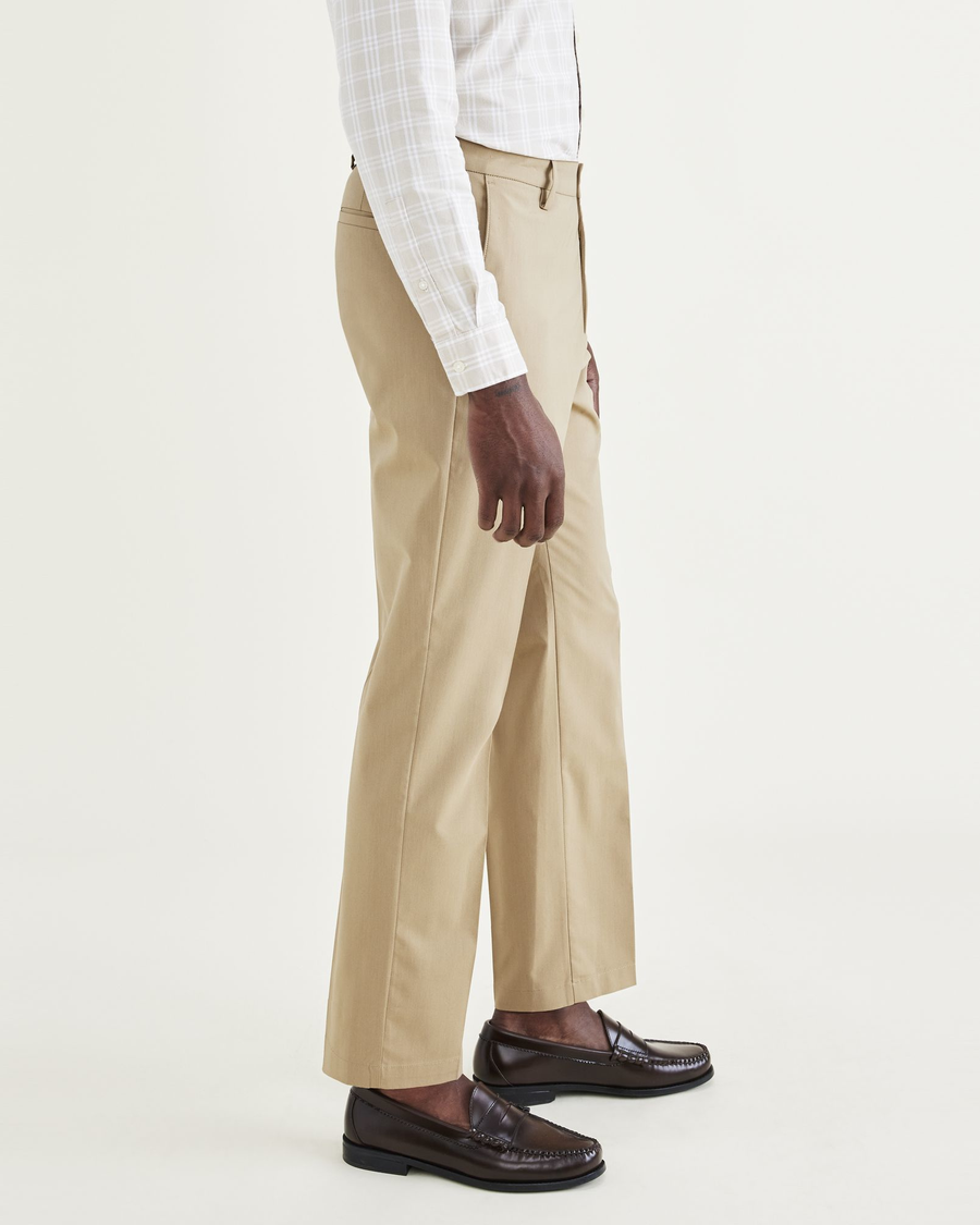 Side view of model wearing Harvest Gold Signature Go Khakis, Straight Fit.