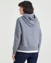 Back view of model wearing Heather Grey Popover Hoodie, Relaxed Fit.