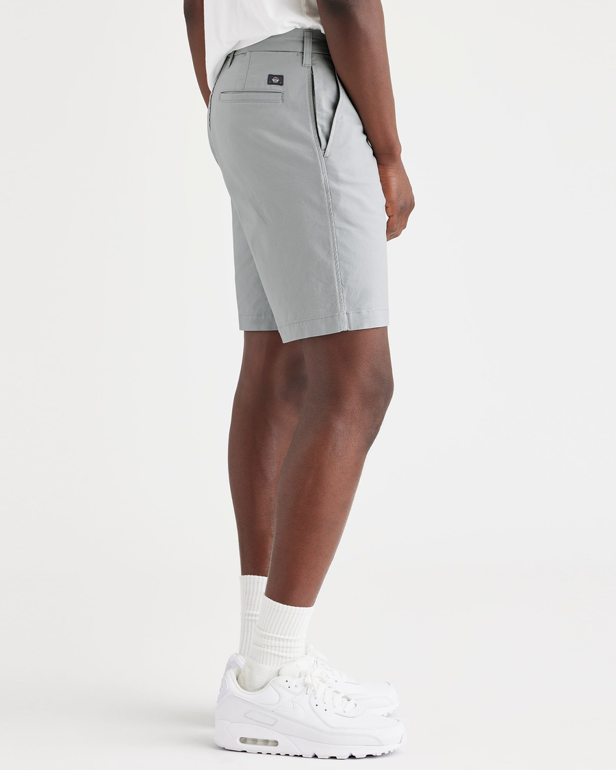 Side view of model wearing High Rise Ultimate 9.5" Shorts, Straight Fit.