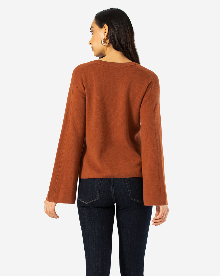 Back view of model wearing Hot Chocolate Bell Sleeve Sweater.