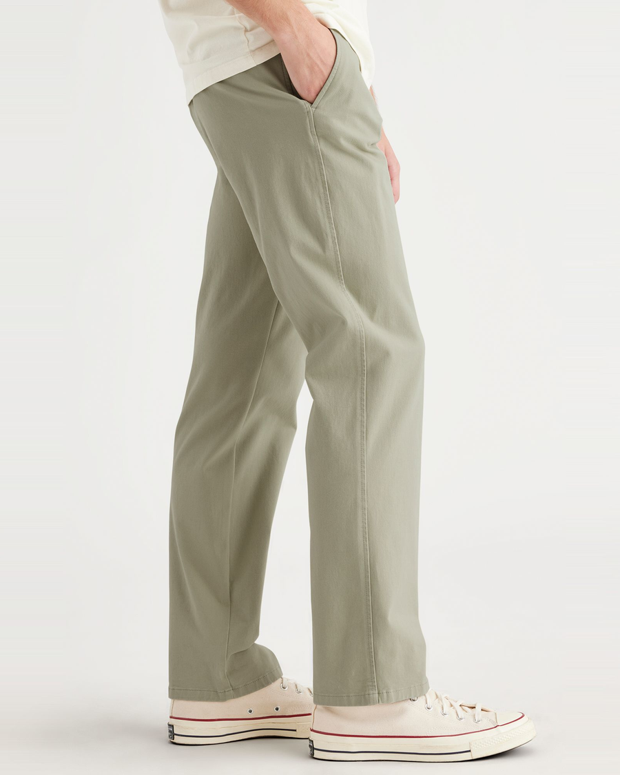 Side view of model wearing Lint Ultimate Chinos, Straight Fit.