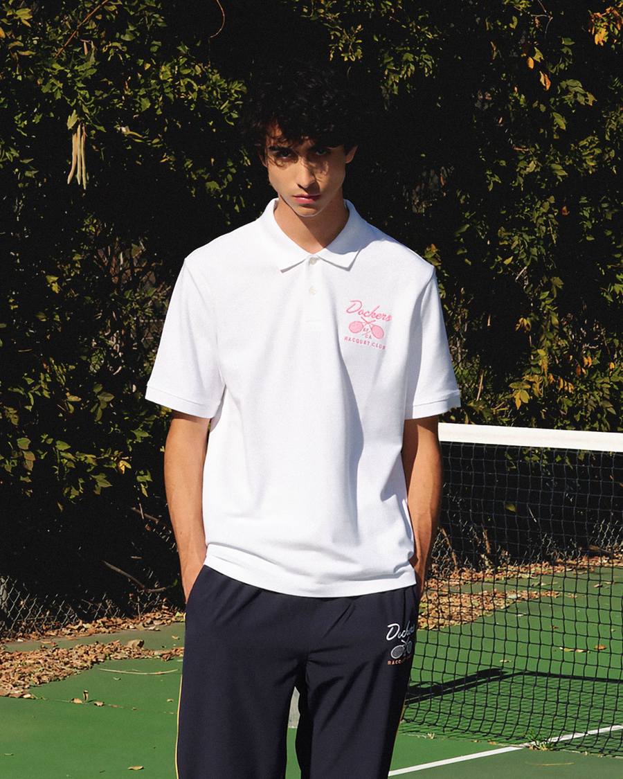 View of model wearing Lucent White Racquet Club All Court Polo, Regular Fit.