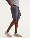 Side view of model wearing Maritime Perfect 8" Shorts.