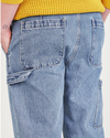 View of model wearing Medium Indigo Stonewash California Carpenter Pants, Straight Fit.