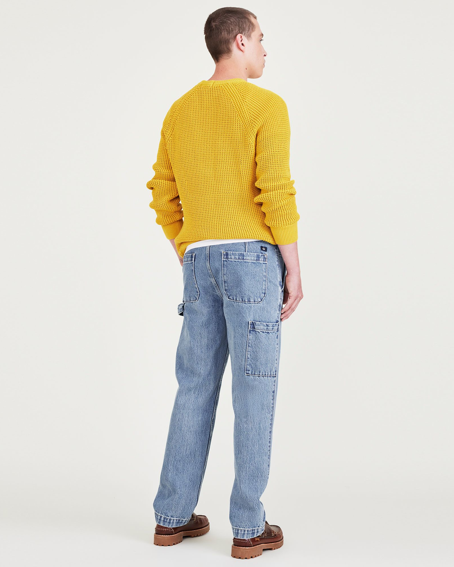 Back view of model wearing Medium Indigo Stonewash California Carpenter Pants, Straight Fit.