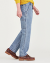 Side view of model wearing Medium Indigo Stonewash California Carpenter Pants, Straight Fit.