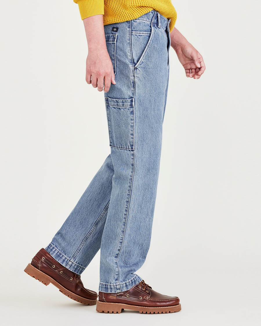 Side view of model wearing Medium Indigo Stonewash California Carpenter Pants, Straight Fit.