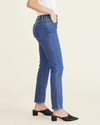 Side view of model wearing Medium Indigo Stonewash Jean Cut Pants, High Slim Fit.