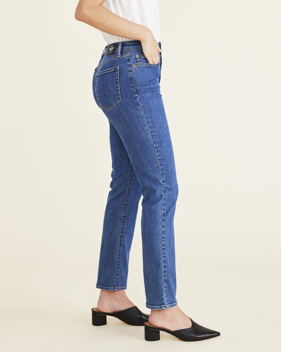 Side view of model wearing Medium Indigo Stonewash Jean Cut Pants, High Slim Fit.
