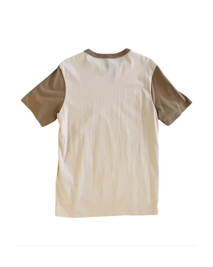 Back view of model wearing Natural & Khaki Dockers® x Transnomadica Tee Shirt.