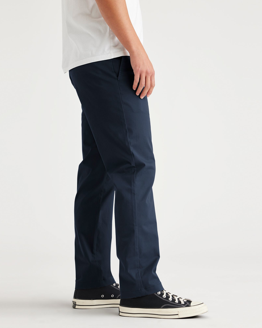 Side view of model wearing Navy Blazer Essential Chinos, Slim Fit.