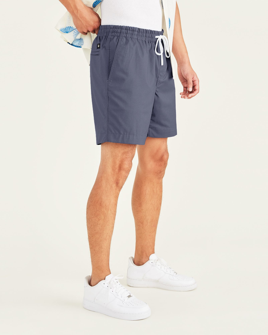 Side view of model wearing Navy Blazer Playa 7" Shorts.