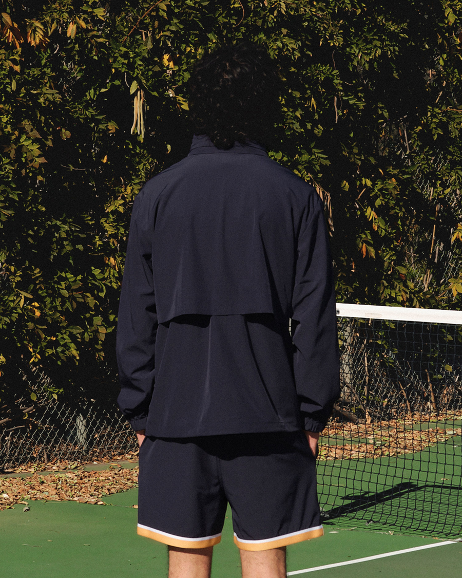 View of model wearing Navy Blazer Racquet Club Collared Anorak, Regular Fit.