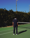 View of model wearing Navy Blazer Racquet Club Court Pant, Relaxed Tapered Fit.