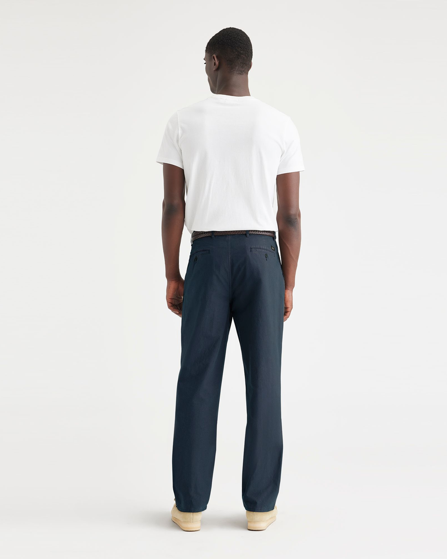 Back view of model wearing Navy Crisp Original Chinos, Relaxed Tapered Fit.