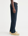 Side view of model wearing Navy Crisp Original Chinos, Relaxed Tapered Fit.