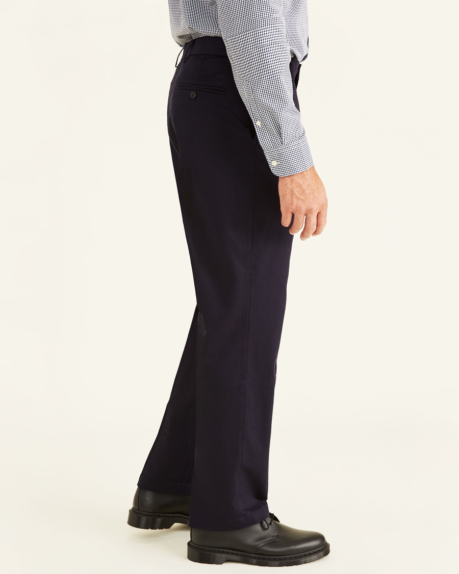 Side view of model wearing Navy Signature Khakis, Classic Fit (Big and Tall).