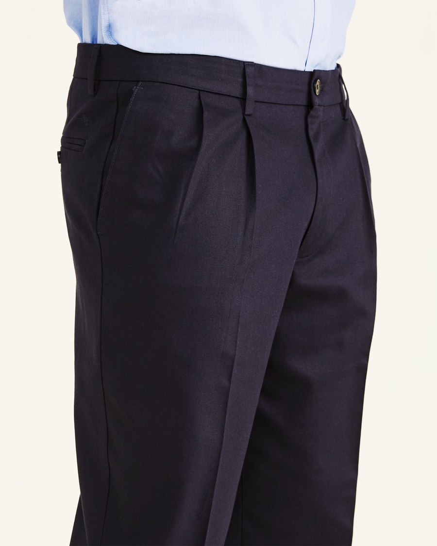 View of model wearing Navy Signature Khakis, Pleated, Classic Fit (Big and Tall).