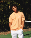 View of model wearing Orange Chiffon Racquet Club All Court Polo, Regular Fit.