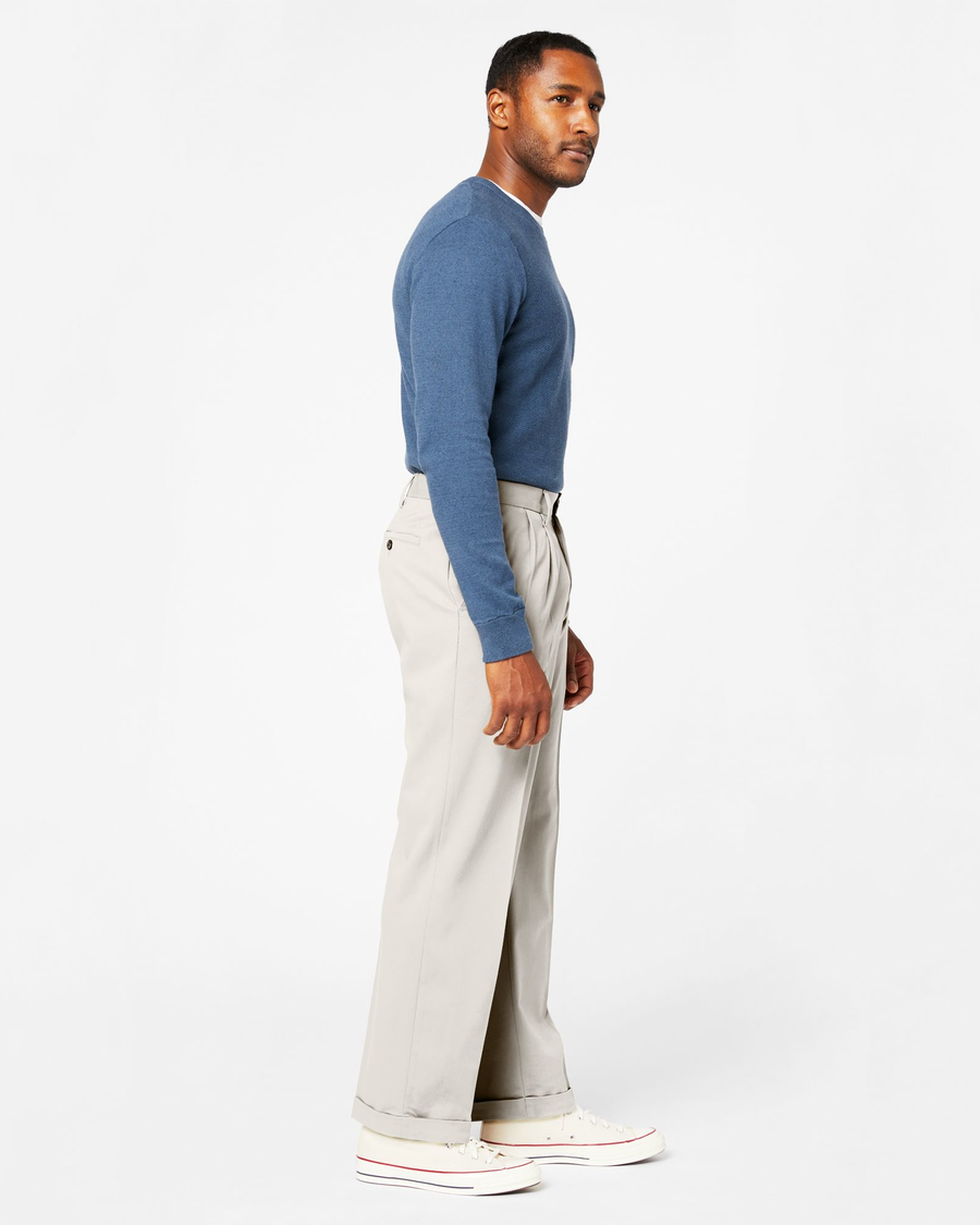 Side view of model wearing Porcelain Khaki Comfort Khakis, Pleated, Relaxed Fit.