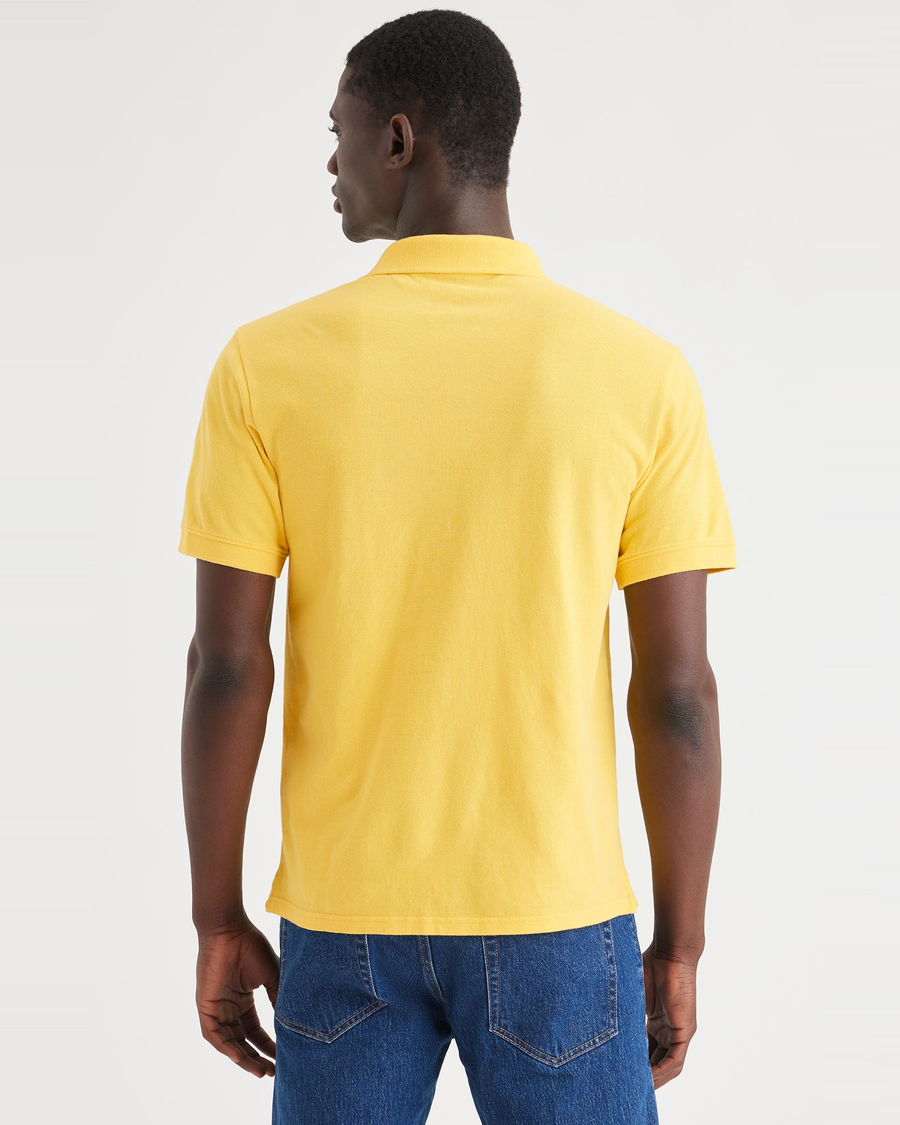 Back view of model wearing Primrose Yellow Rib Collar Polo, Slim Fit.
