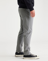 Side view of model wearing Sharkskin Go Pant, Slim Tapered Fit with Airweave.