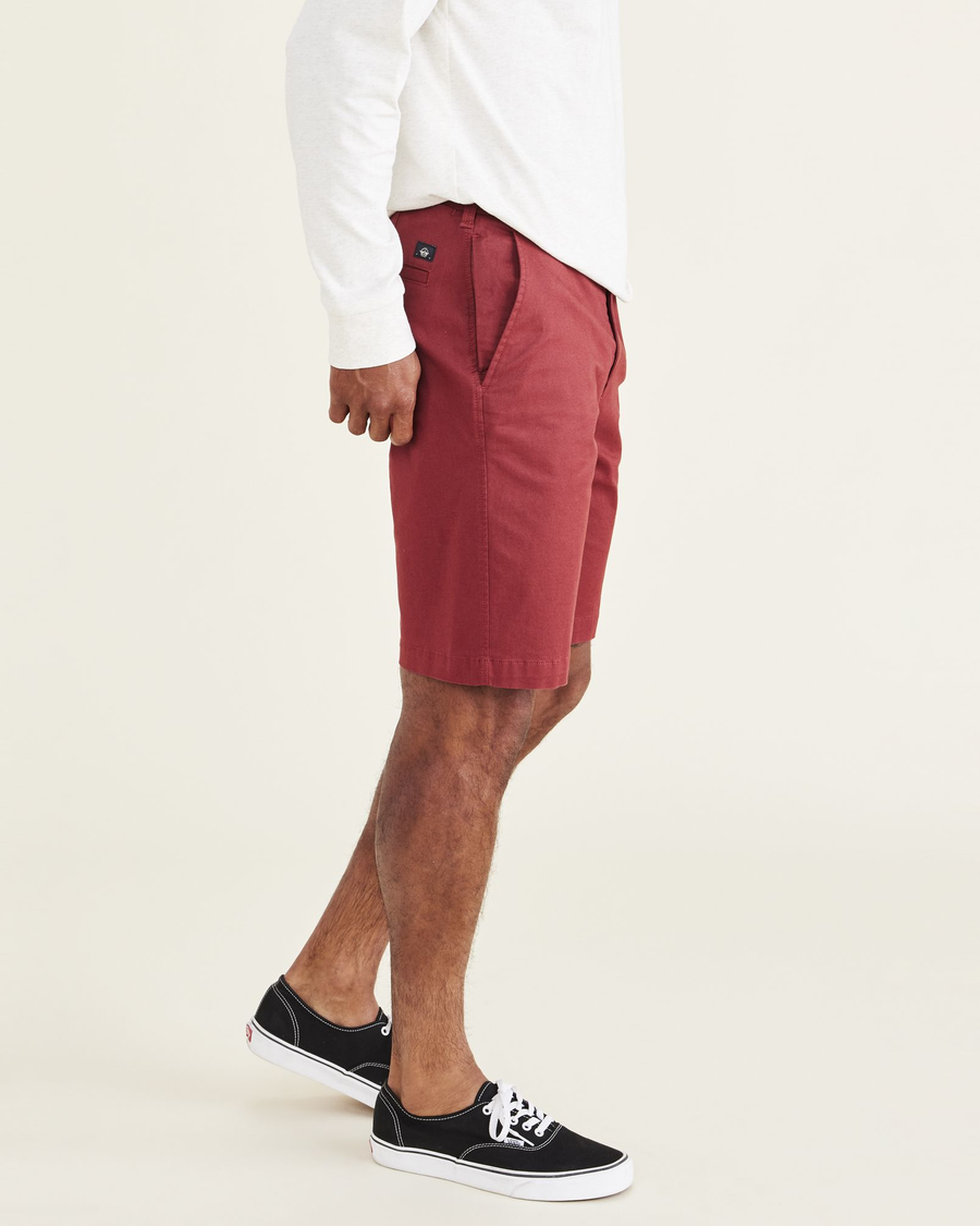 Side view of model wearing Spiced Apple Ultimate 9.5" Shorts.