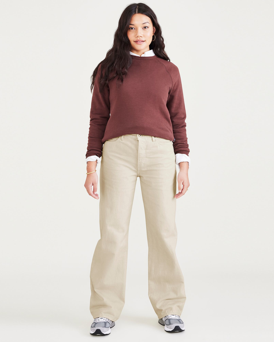Front view of model wearing Tan Mid-Rise Jeans, Relaxed Fit.