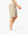 Side view of model wearing Taupe Sand Tech Cargo 9" Shorts.
