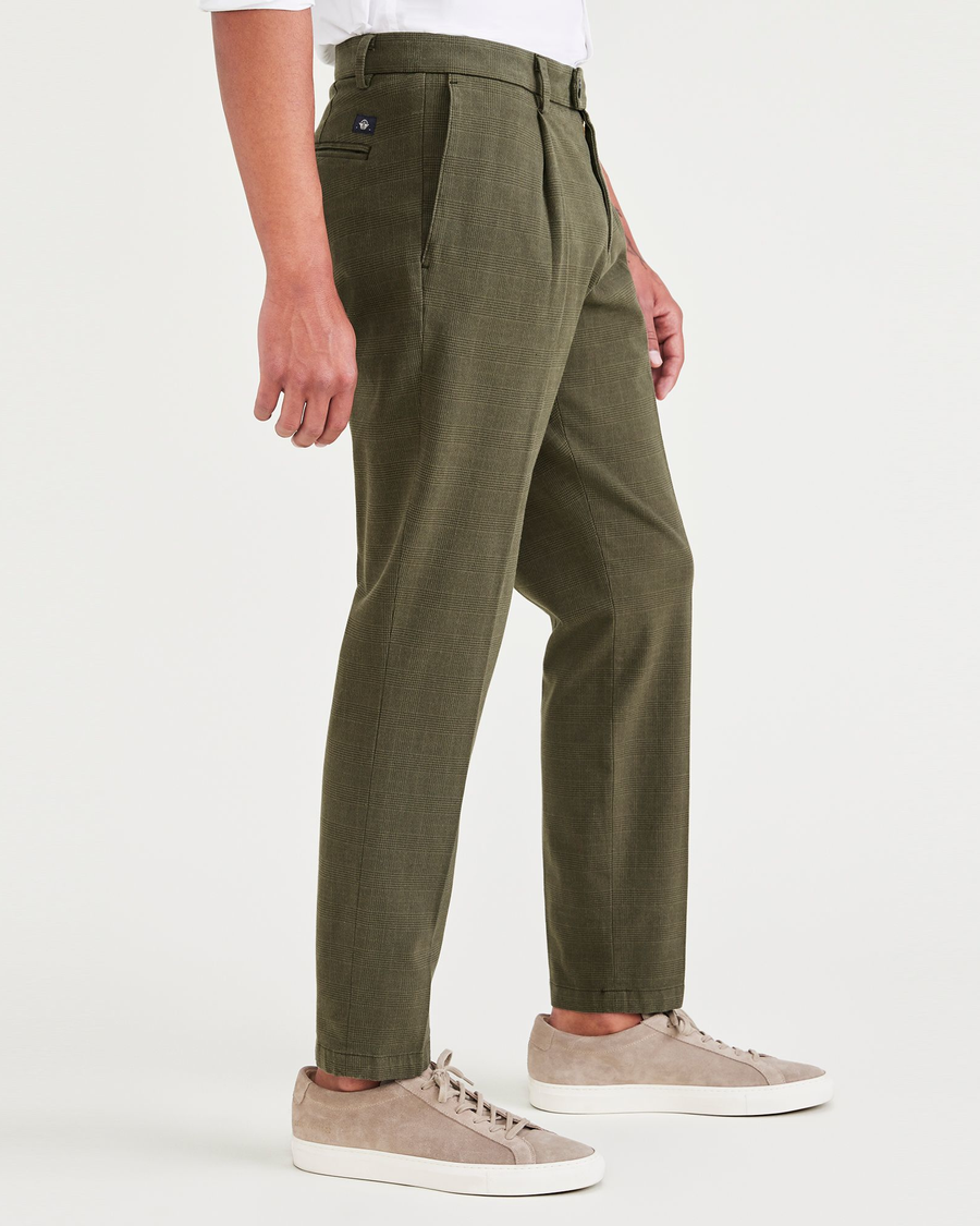 Side view of model wearing Tempo Forest Night Crafted Trousers, Slim Tapered Fit.
