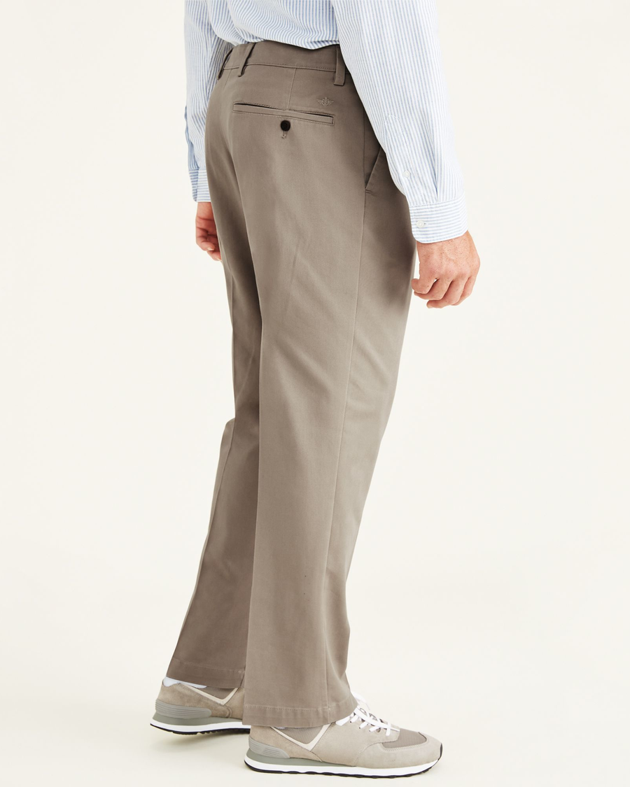 Side view of model wearing Timber Wolf Easy Khakis, Pleated, Classic Fit (Big and Tall).